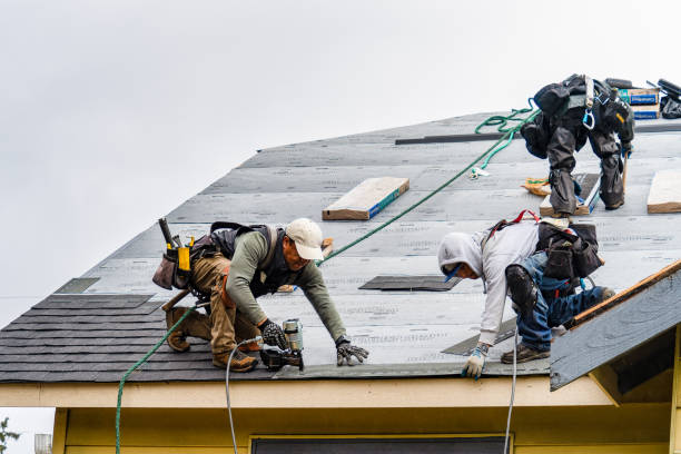 Professional Gutter Installation technician working in Berlin, NH